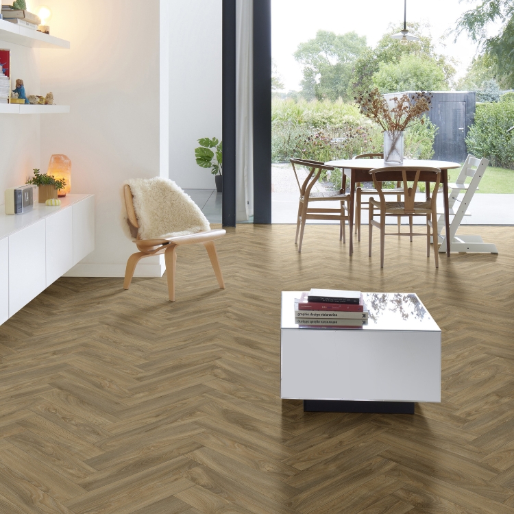 A living space with herringbone floor