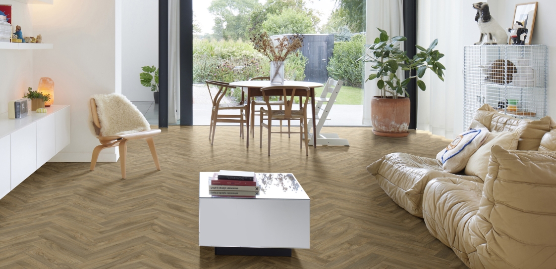 A living space with herringbone floor